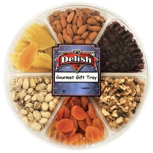 May include: A clear plastic tray filled with a variety of snacks, including almonds, dried cranberries, pistachios, dried apricots, walnuts, and dried mango. The tray has a label that reads "It's Delish Gourmet Gift Tray Pareve".