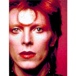 May include: A close-up portrait of a person with red hair and a white circle on their forehead. The person is wearing red lipstick and has a serious expression.