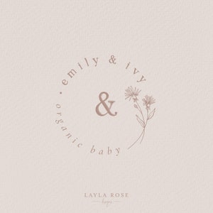 May include: A logo design for a company called "emily & ivy organic baby" with a stylized ampersand and floral illustration. The text "LAYLA ROSE designs" is also included.