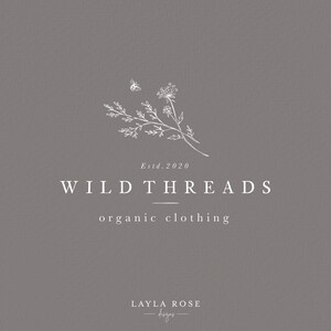 May include: A white logo design on a gray background with the text "Wild Threads organic clothing" and "Estd. 2020". The logo also features a stylized drawing of a flower and a bee.