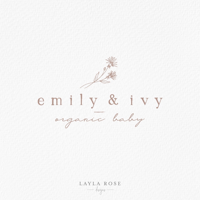 May include: A logo for a business called "emily & ivy organic baby" with a simple line drawing of two flowers and a stem. The text "LAYLA ROSE designs" is also included in the logo.