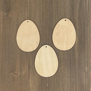 UOVA DI PASQUA figure in legno, simboli pasquali, giocattolo appeso, decorazione per lo spazio dei bambini, spazi vuoti tagliati al laser, decorazione per l'albero di Pasqua, forma di uovo non colorato