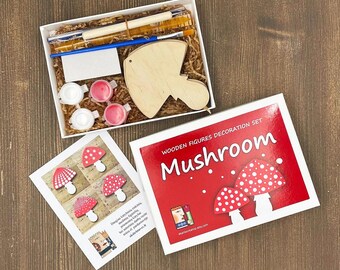 May include: A wooden mushroom craft kit with red and white paint, a brush, and a wooden mushroom shape. The box is labeled "Wooden Figures Decoration Set Mushroom".