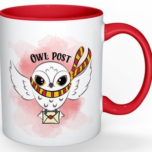 May include: White ceramic mug with a red rim and handle. The mug features a cartoon illustration of a white owl with yellow eyes and a red and yellow scarf. The owl is holding a letter and the text "Owl Post" is written above the owl.