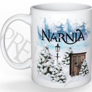 May include: White ceramic mug with a winter scene featuring a snowy landscape, trees, a lamppost, and a small wooden building. The text "Narnia" is printed in black on the mug.