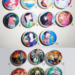 May include: Set of 16 round wooden knobs featuring colourful Disney princess and villain character images. The knobs depict characters such as Cinderella, Snow White, Ariel, Pocahontas, and Maleficent.
