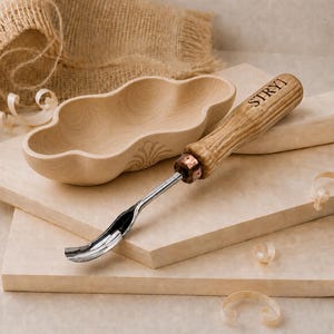 May include: A light-colored wooden bowl with a scalloped edge and a metal wood carving tool featuring a wooden handle branded with the text STRYI. The tool has a curved, polished metal blade and a copper-colored metal ferrule at the base.