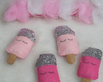 Tulle and pink ice cream bars with silver glitter, a very girly wall decoration for a girl's room