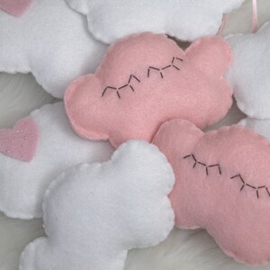 Cutest felt cloud garland for kids'/baby room: white, sparkly clouds and a sleepy pink cloud with eyelashes image 1