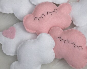 Cutest felt cloud garland for kids'/baby room: white, sparkly clouds and a sleepy pink cloud with eyelashes
