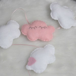 Cutest felt cloud garland for kids'/baby room: white, sparkly clouds and a sleepy pink cloud with eyelashes image 2