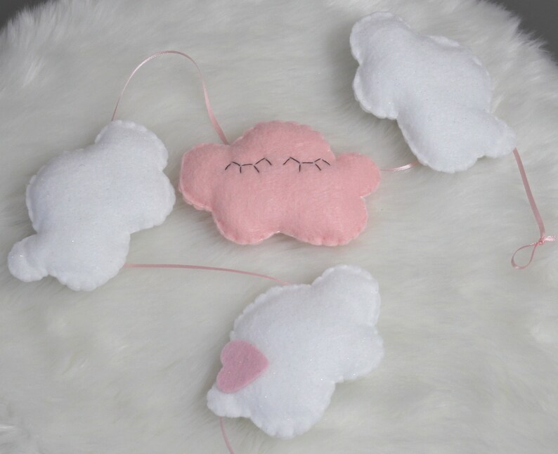 Cutest felt cloud garland for kids'/baby room: white, sparkly clouds and a sleepy pink cloud with eyelashes image 2