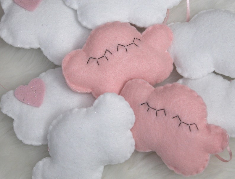 Cutest felt cloud garland for kids'/baby room: white, sparkly clouds and a sleepy pink cloud with eyelashes image 1