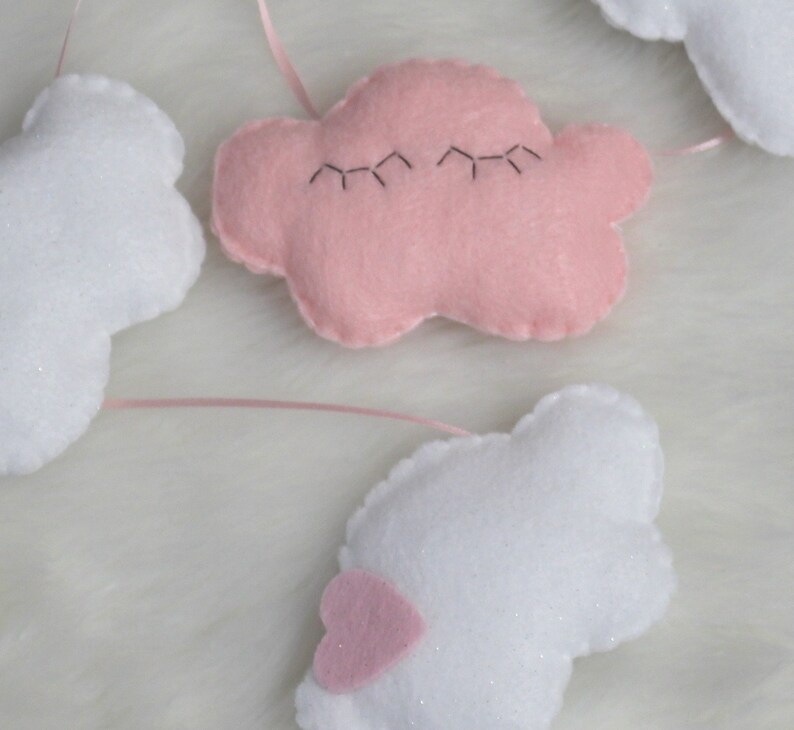 Cutest felt cloud garland for kids'/baby room: white, sparkly clouds and a sleepy pink cloud with eyelashes image 3