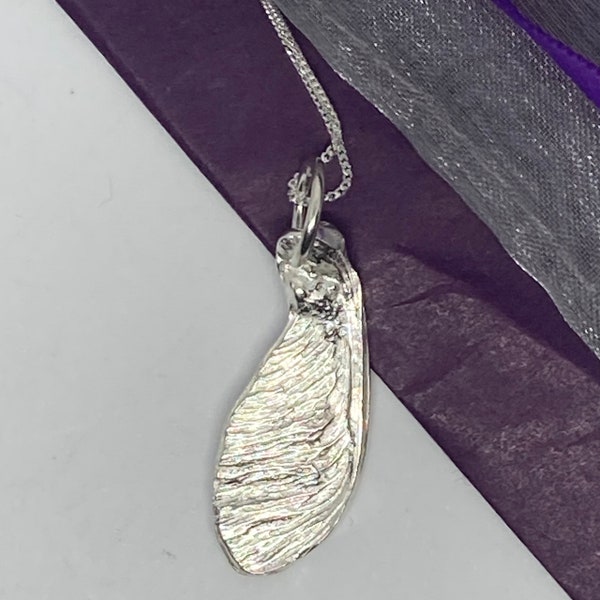 Solid fine silver sycamore seed pendant on a sterling silver chain