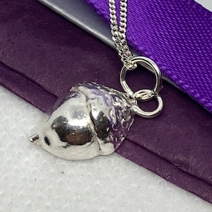 Fine silver acorn cast from a real acorn and suspended on a sterling silver chain