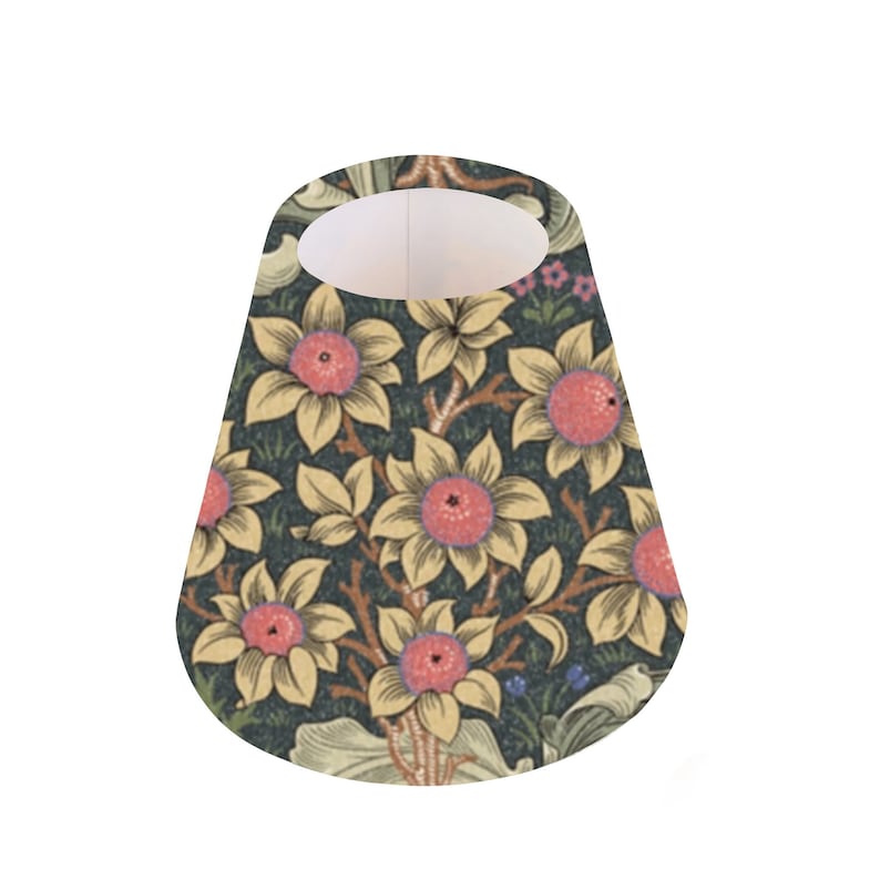 May include: A cone-shaped lampshade with a floral pattern. The pattern features yellow flowers with pink centers on a dark green background.