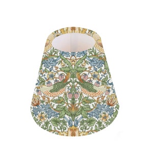 May include: A cone-shaped lampshade with a white background and a repeating pattern of birds, flowers, and leaves in shades of green, blue, yellow, and orange.