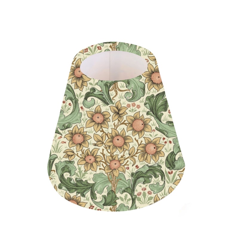 May include: A cone-shaped lampshade with a floral pattern. The pattern features yellow flowers with orange centers, green leaves, and small red flowers on a cream background.