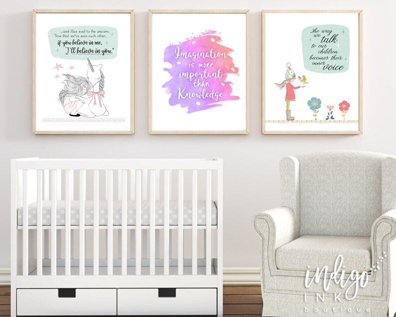May include: Three framed art prints with inspirational quotes and illustrations. One features a girl with a bird, another a unicorn, and the third a colorful watercolor background with text. The prints are in a nursery setting.