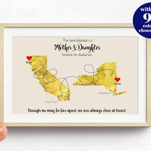 May include: A gold foil map of the United States with a red heart marking California and New York. The text reads "The love between a Mother & Daughter knows no distance. Though we may be far apart, we are always close at heart."