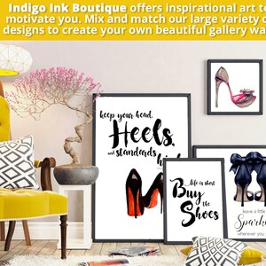 May include: Three framed art prints with black frames and white backgrounds. The prints feature black and white illustrations of high heels with inspirational quotes. The first print says "Keep your head. Heels. and standards high". The second print says "Life is short. Buy the shoes". The third print says "Leave a little sparkle wherever you go".