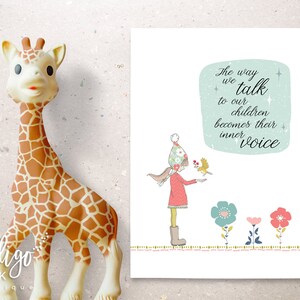 May include: A soft, tan giraffe toy with brown spots stands next to a print with the text "The way we talk to our children becomes their inner voice." The print features a girl with a bird and colorful flowers.