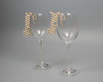 Lettering as place card made of natural wood for glasses with heart