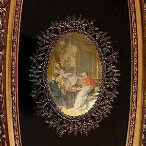 May include: An oval wall mirror with an ornate gold frame featuring a black glass panel. The panel displays three distinct circular vignettes depicting historical scenes, separated by decorative gold filigree accents and a central oval scene.
