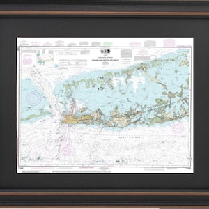 May include: A nautical chart of the Florida Keys, showing the waterways from Sugarloaf Key to Key West. The chart is printed in black and white and includes depth soundings, navigational aids, and other important information for boaters.