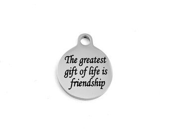 May include: Silver charm with the inscription "The greatest gift of life is friendship".