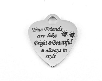 May include: Silver heart-shaped charm with the inscription "True Friends are like Bright & Beautiful & always in style" and two small diamond symbols.