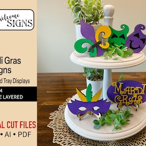 Peut inclure: Un ensemble de quatre motifs de Mardi Gras à double couche pour présentoirs à plateaux étagés. Les motifs comprennent un fleuron de lys, deux masques et une pancarte qui dit "Mardi Gras".