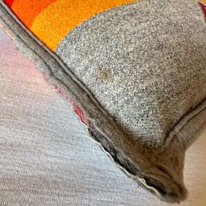 May include: A trio of ceramic mugs with a speckled, matte finish in cream, light grey, and dark grey. Each mug features a simple, minimalist design, ideal for tea or coffee.