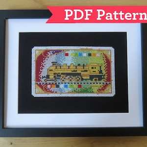 May include: A framed cross-stitch pattern of a yellow train engine with black wheels and a red and gold background. The pattern includes a colour key with different coloured squares.