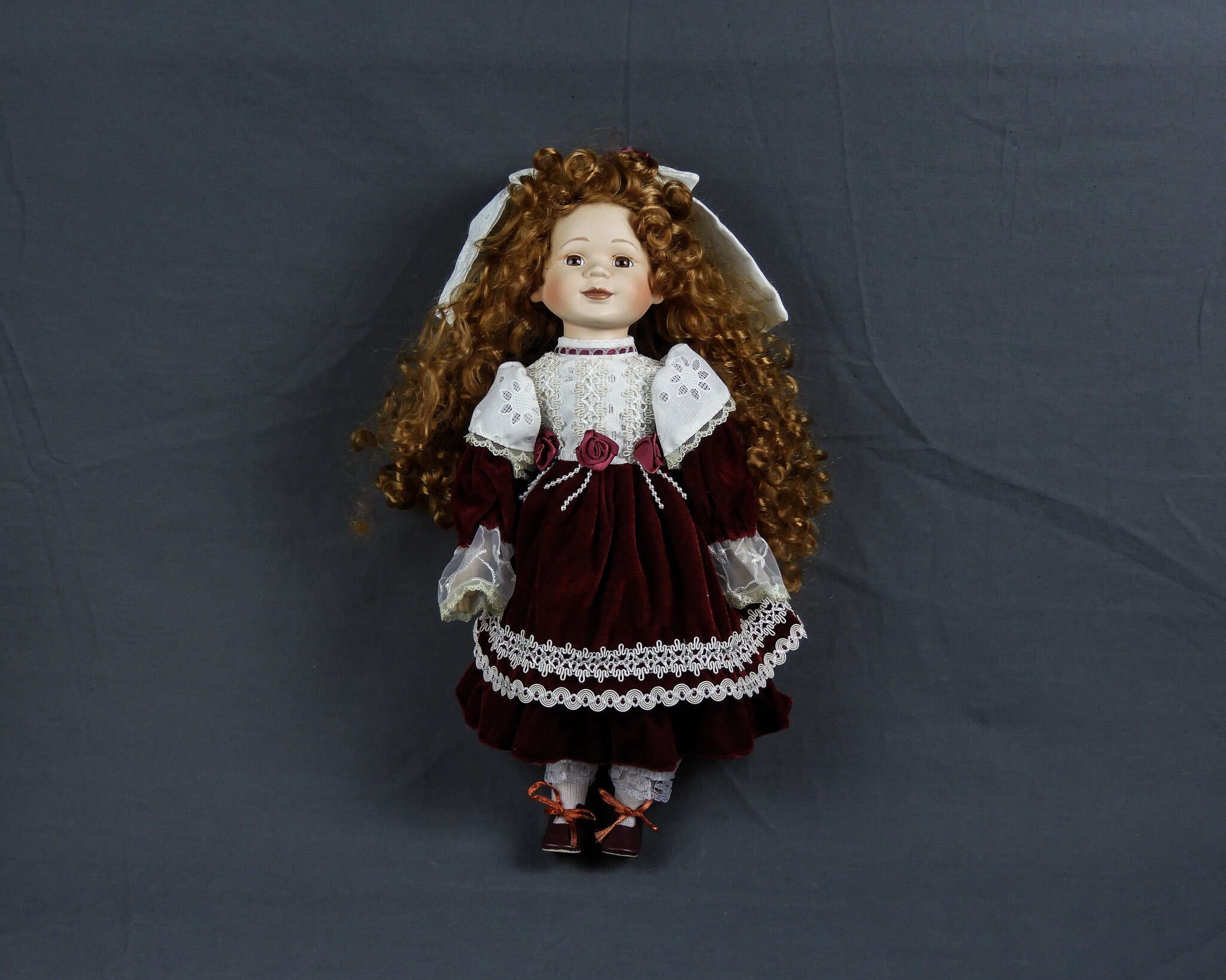 porcelain doll red velvet dress