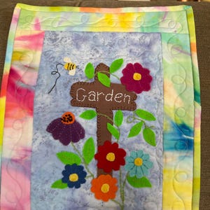 The “Garden” hand embroidered wool appliquéd wall hanging