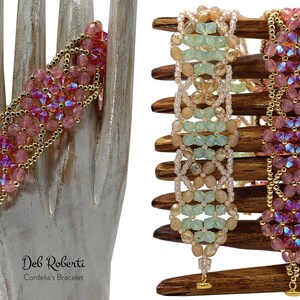 May include: Two beaded bracelets with a gold chain detail. The bracelet on the left is pink and the bracelet on the right is green, beige, and white. The bracelets are on a wooden display stand. "Deb Roberti Cordelia's Bracelet" is written below the bracelets.