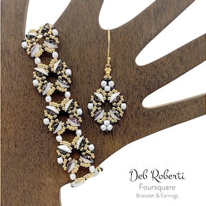 May include: A white and brown beaded bracelet and matching earrings with a geometric design. The jewelry is displayed on a wooden hand.