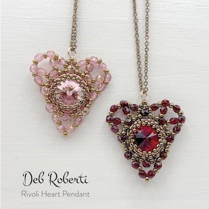 May include: Two beaded heart pendants with a gold chain. The pendant on the left is pink and the pendant on the right is red. Both pendants feature a clear crystal in the center.