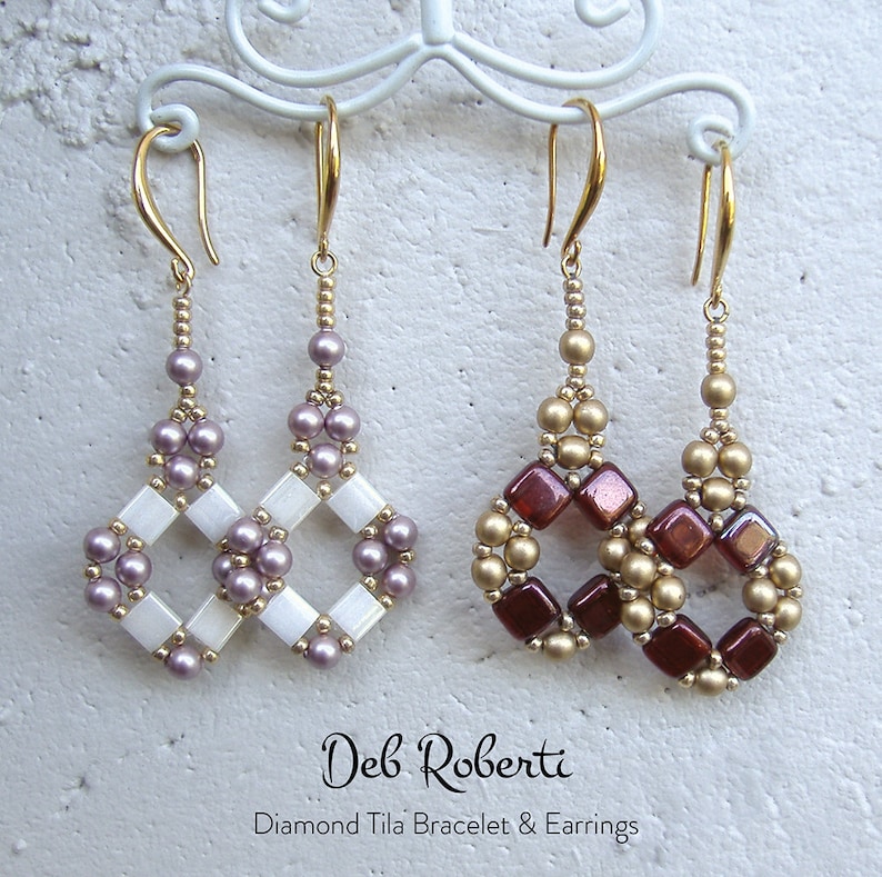 May include: Three pairs of beaded earrings hanging from a white metal stand. The earrings are made with white, gold, and purple beads. The earrings are in the shape of a diamond. The text "Deb Roberti Diamond Tila Bracelet & Earrings" is at the bottom of the image.