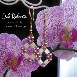 May include: A pair of purple and white beaded earrings with a diamond tile design, hanging from a gold hook, against a background of purple orchids.
