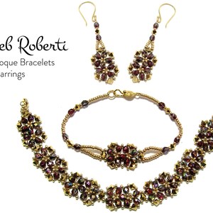 May include: A set of gold beaded earrings and bracelets with burgundy and gold accents. The earrings are teardrop shaped and the bracelets are a delicate chain with a floral design. The jewelry is labeled "Deb Roberti Baroque Bracelets & Earrings".