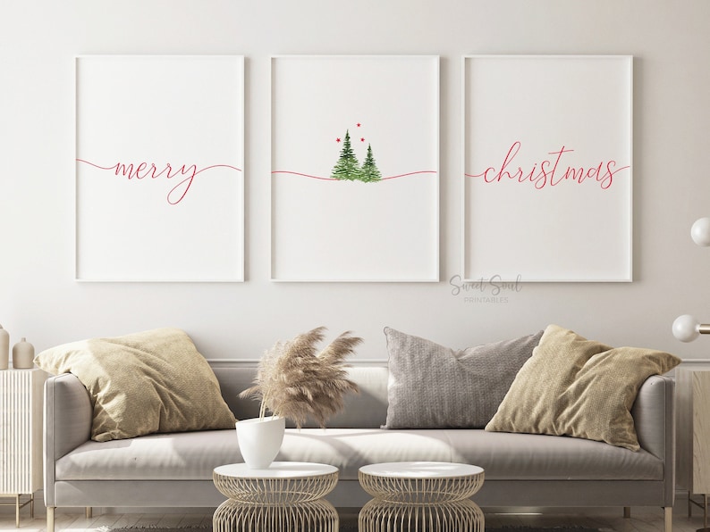 May include: Three white framed prints with red text and a watercolor illustration of two Christmas trees. The left print says "merry", the middle print has two green Christmas trees with red berries, and the right print says "christmas".