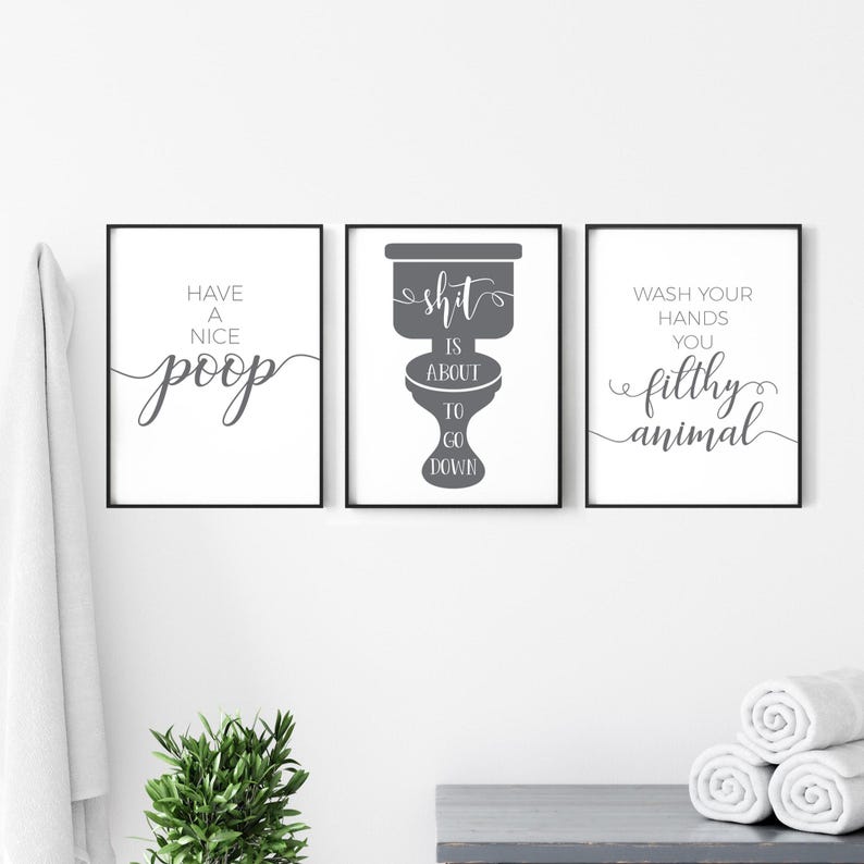 May include: A set of three framed wall art prints with black frames and white backgrounds. The left print reads Have a Nice Poop, the center print features a toilet graphic with the text Shit is About to Go Down, and the right print reads Wash Your Hands You Filthy Animal.