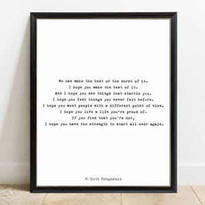 May include: A framed wall art print featuring black typewriter-style text on a white background. The quote reads: We can make the best or the worst of it. I hope you make the best of it. I hope you have the strength to start all over again.
