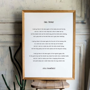 May include: A framed print of a poem titled "Sea Fever" by John Masefield. The poem is printed in a typewriter font on white paper with a black frame.