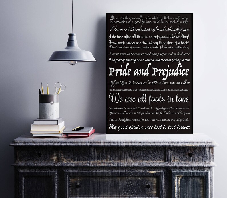 May include: Black and white typography print with quotes from the novel "Pride and Prejudice" by Jane Austen. The quotes are printed on a black background with white text. The print is framed and hanging on a wall.