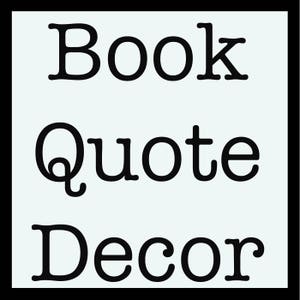 May include: Black and white text on a light blue background. The text reads "Book Quote Decor".