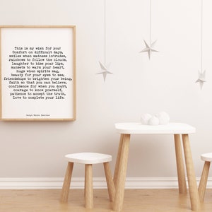 May include: A framed print with a white background and black text. The text is a poem about wishing for comfort, smiles, rainbows, laughter, sunsets, hugs, beauty, friendships, faith, confidence, courage, patience, and love. The poem is titled "This is my wish for you" and is signed "Nigel Hale Emerson".